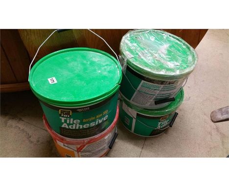 Four buckets of tile adhesive