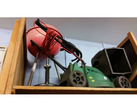 Shelf of assorted including a lawnmower