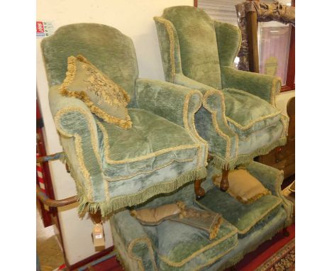 An early 20th century walnut framed and later green draylon upholstered three-piece suite, comprising three-seater sofa, w.16