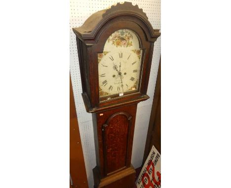 A circa 1800 provincial oak longcase clock, the arched floral painted dial signed Freeman Bardfield, with subsidiary seconds 