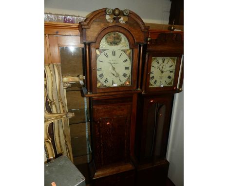 An early 19th century provincial oak and mahogany crossbanded longcase clock, the arched painted 13" dial signed Thomas Humph