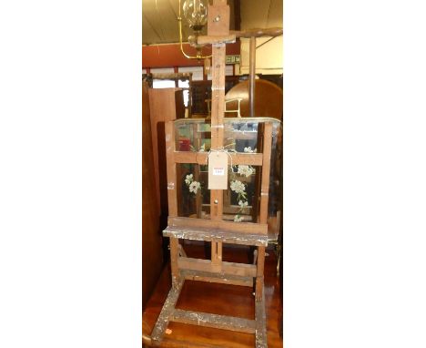 A contemporary beech table-top artists easel; together with late Victorian brass and mirrored glass fire screen (2)