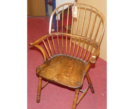 An early 19th century elm stick back Windsor chair, width 58cmCondition report: With replacement section to seat.Legs are wob