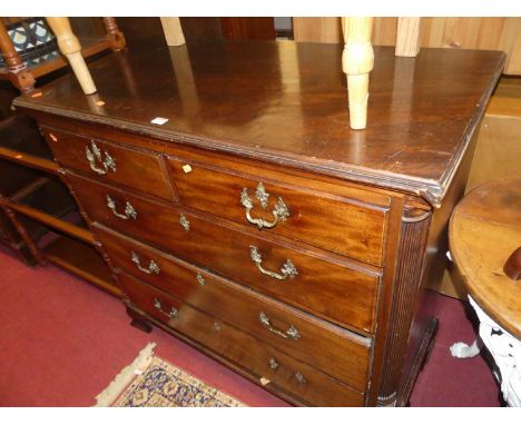 An early 19th century mahogany squarefront chest of two short over three long graduated drawers, raised on ogee bracket suppo