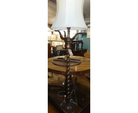 An early 20th century spiral turned oak standard lamp with shade
