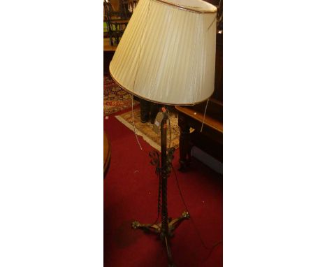 An Art Nouveau brass and copper mounted telescopic standard lamp 