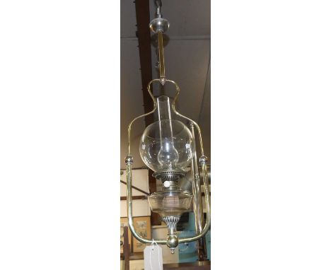 A circa 1900 tubular brass framed and glass inset hanging paraffin lamp, approx drop 85cm 