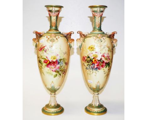 Pair of Royal Worcester blush ivory vases with blooming floral sprays,ornate twin handles with gilt and head decoration, Circ