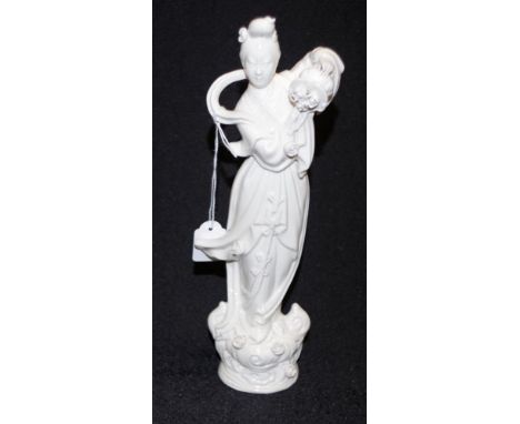 Chinese blanc de chinese Guanyin figure standing figure, on ornamental  ceramic base, marked to base, (height 26cm approx).