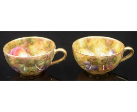 Two Royal Worcester h/p miniature fruit cups both signed Freeman. One handle repaired. 2.7cm high.