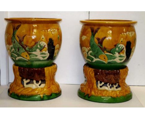 Good pair large Chinese ceramic fish pots each blossom decorated on brown ground, and each on a separate decorative base, (he