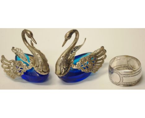 Pair German silver swan form open salts each swan form marked '835,' with silver salt spoons, to blue glass open salt bodies;