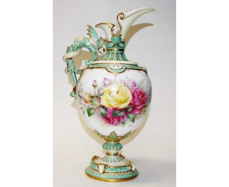 Large Royal Worcester handpainted ewer signed H.Chair, decorated with festoons of roses, ornate in relief dragon handle and m