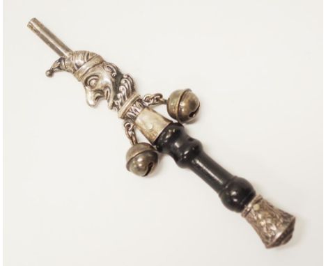 Early silver baby's rattle 'Punch' handle decorated to handle with embossed 'Punch,' portrait, with attached bells, to a carv