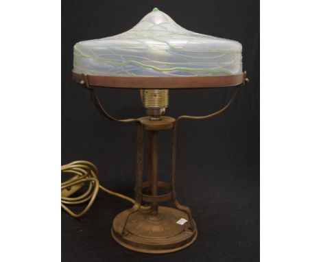 Austrian Art Nouveau electric table lamp with a brass base and Loetz glass shade, height 35cm approx