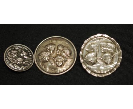 Three various Edward VII silver cupid buttons each with Birmingham hallmark, circa 1904, embossed cupid decoration, (diameter