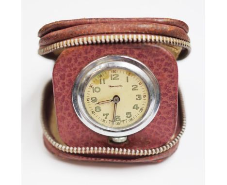 Vintage 'Newmark' leather cased travelling clock needs service.