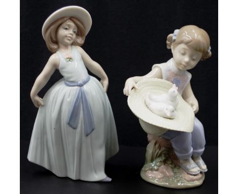 Two various Lladro ceramic figures including: Girl in Blue dress, and Girl with Chickens, each signed to base, (height 18cm a