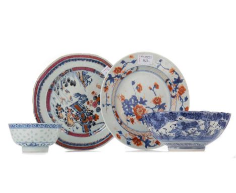 TWO CHINESE 18TH CENTURY PLATES,the first in the Imari palette, 23cm diameter, the second featuring garden and river landscap