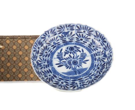 CHINESE BLUE &amp; WHITE PORCELAIN SAUCER,Kangxi Period, decorated with floral blooms, artemisia leaf mark within double ring