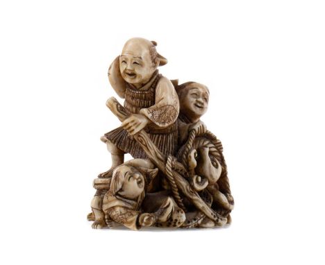 JAPANESE IVORY NETSUKE,Tokyo School, Meiji Period (1868-1912), carved as three fishermen catching an octopus, with signed tab