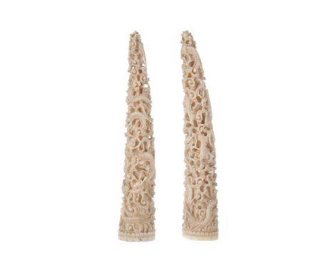 PAIR OF SMALL CHINESE IVORY TUSKS,late 19th/early 20th century, carved with dragons and scrolls in high relief, 19cm highCond