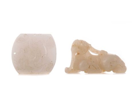 TWO CHINESE HARDSTONE CARVINGS,the first modelled as a qilin, 6cm long, the second an amulet featuring a qilin in low relief 