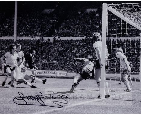 Trevor Brooking signed 1980 F.A. Cup Final b&w photographic print of his winning goal for West Ham against Arsenal, signed in