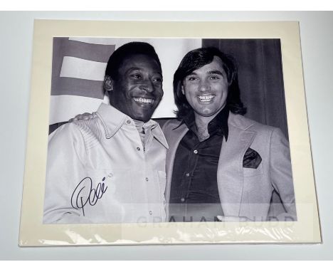 Large Pele signed b&w photographic print featuring his meeting with George Best,signed in black marker pen, 59 by 69cm. overa