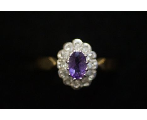 9ct gold dress ring set with diamonds and central amethysts 2.6 grams, size-M