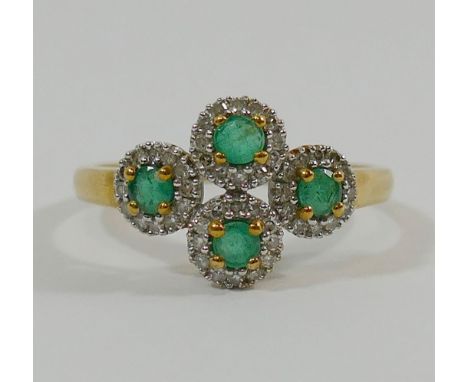 A 9 carat gold emerald and diamond dress ring, set with four circular clusters, the round mixed cut emeralds each set within 