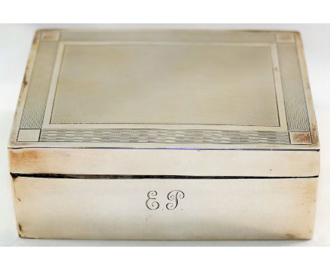 A George V silver cigarette box, Birmingham 1925, with engine turned decoration and wooden lined interior, 12.2cm x 9.4cm x 4