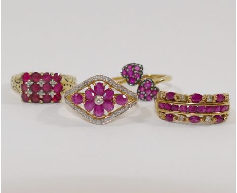 A 9 carat gold ruby and diamond dress ring, the flower head design within open surround and diamond set border, finger size Q