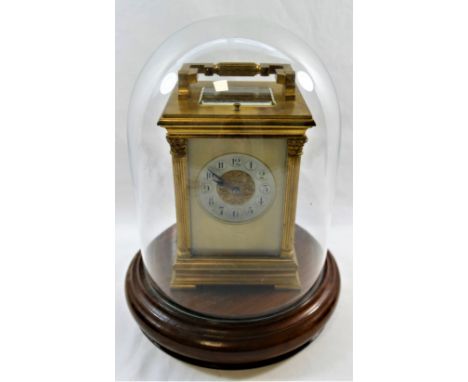 A late 19th century/early 20th century French carriage clock with eight day repeating movement striking on a gong, the backpl