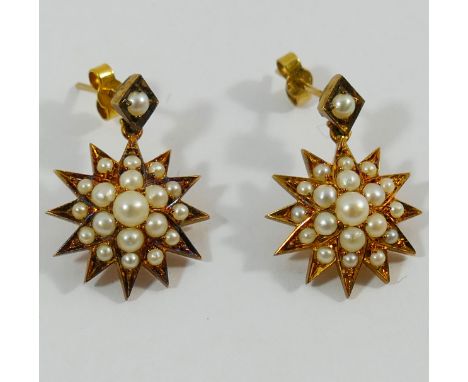 A pair of Victorian half pearl set star burst drop earrings, 2.4cm long, with stick backs, unmarked CONDITION REPORT: If you 