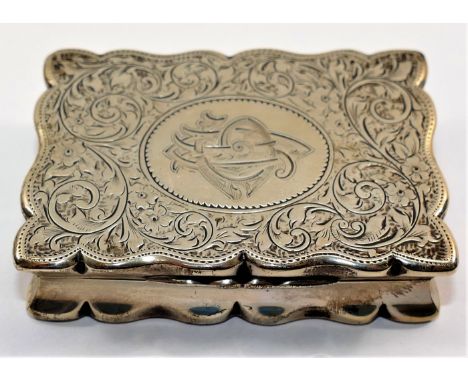 A Victorian rectangular silver snuff box, Birmingham 1897 by Henry Charles Freeman, with wavy edges, engraved scrolling acant