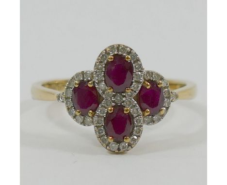 A 9 carat gold ruby and diamond cocktail ring, comprised of four oval clusters, Birmingham 2009, the four oval mixed cut rubi