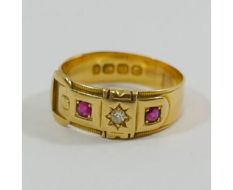 A Victorian 18 carat gold ruby and diamond buckle ring, the round brilliant cut diamond approximately 0.05 carats, housed in 