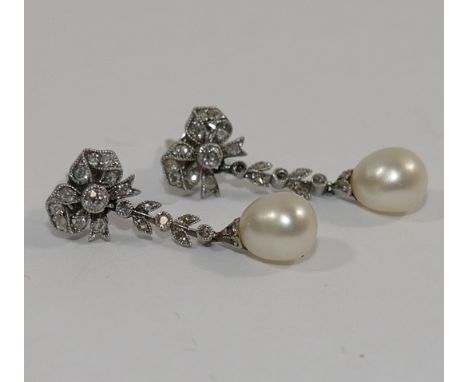 A pair of early 20th century diamond and pearl drop earrings, each set with a single 6mm long pearl (possibly natural - untes