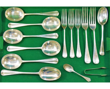Five silver rat tail pattern soup spoons, a matching table spoon and dessert spoon, London 1928 by Josiah Williams and Co., t