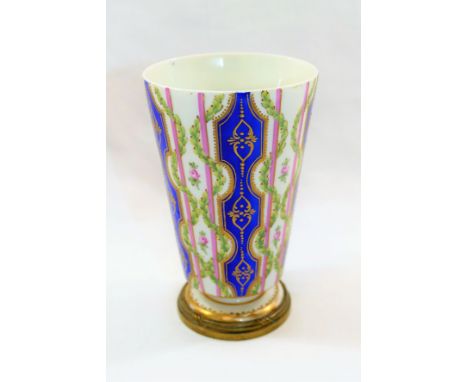 An 18th century Sevres porcelain vase, of tapering cylindrical form with gilt metal mounted foot, decorated in enamels, the b