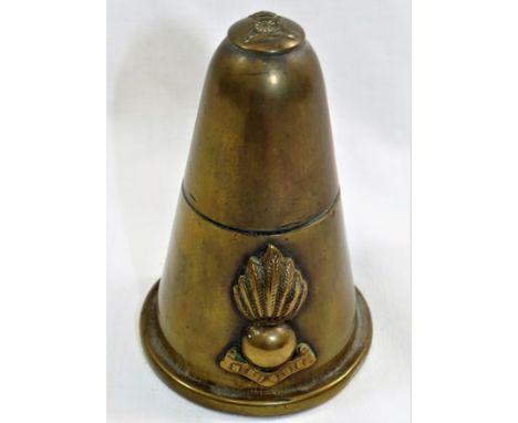 A Royal Artillery brass shell lighter made from the tip of a shell with brass button mounted to the top of the hinged lid and