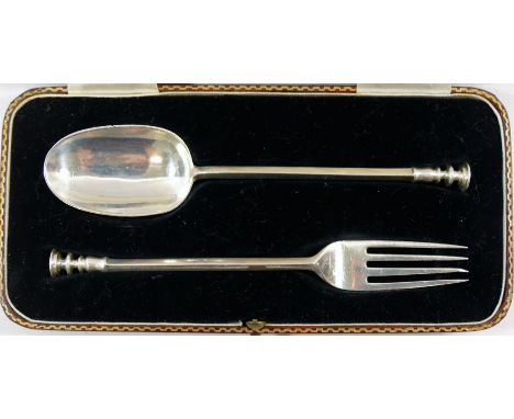 A George V silver christening set with seal tops, comprising spoon and fork, Sheffield 1932 by Charles Williams Fletcher, spo