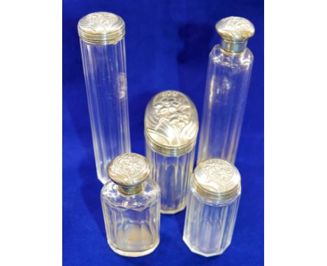 A set of five Edwardian silver topped panel cut glass dressing table bottles, London 1909 maker's mark possibly Fattorini and