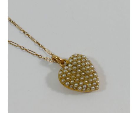 A heart-shaped half seed pearl set pendant on chain, the pendant stamped '15CT', 1.8mm long, with glazed keepsake panel to th