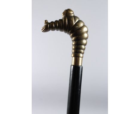 A MICHELIN HANDLE WALKING STICK. 36ins long.
