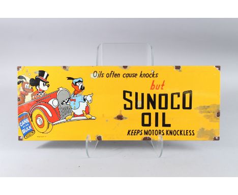 A SUNOCO OIL DISNEY ENAMEL SIGN. 9ins x 23ins.