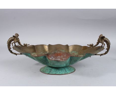 A COPPER AND ENAMEL OVAL SHAPED COMPORT with dragon handles. 17ins long.