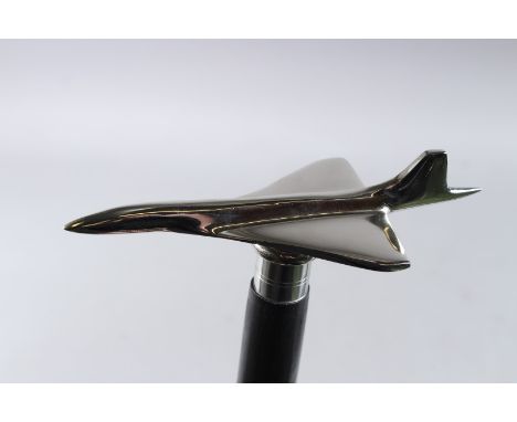 A CONCORDE HANDLE WALKING STICK. 36ins long.