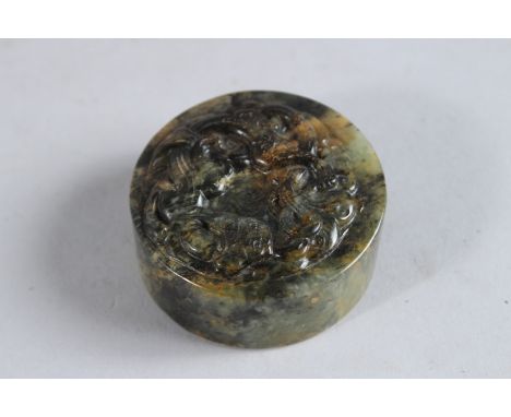 A JAPANESE ROUND JADE SEAL. 2ins diameter.